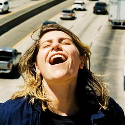 CD cover featuring a woman with eyes closed, laughing joyfully.