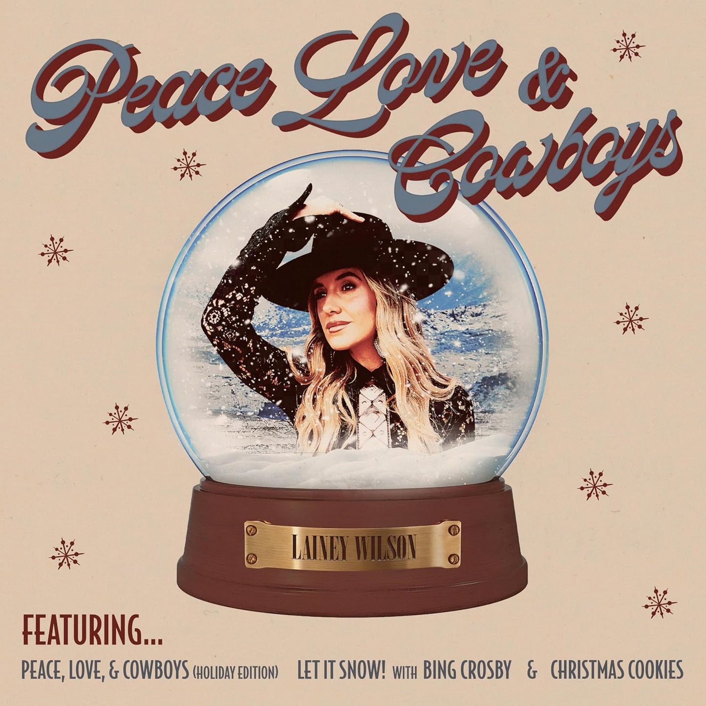 CD cover: Lainey Wilson portrait inside a snow globe, festive design.