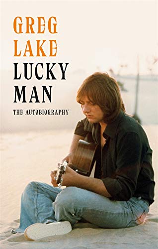 Book cover showing Greg Lake sitting on a beach playing an acoustic guitar.