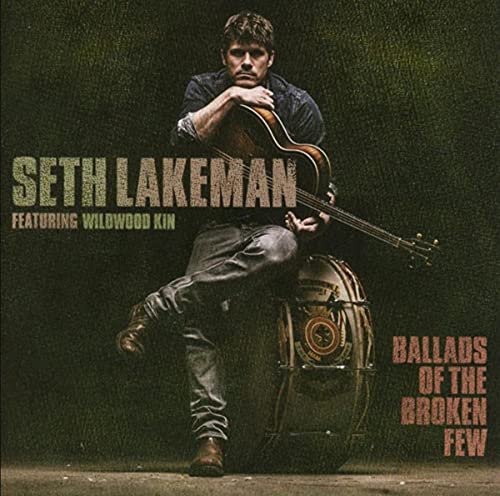 Seth Lakeman album cover featuring a man with a guitar and drum.