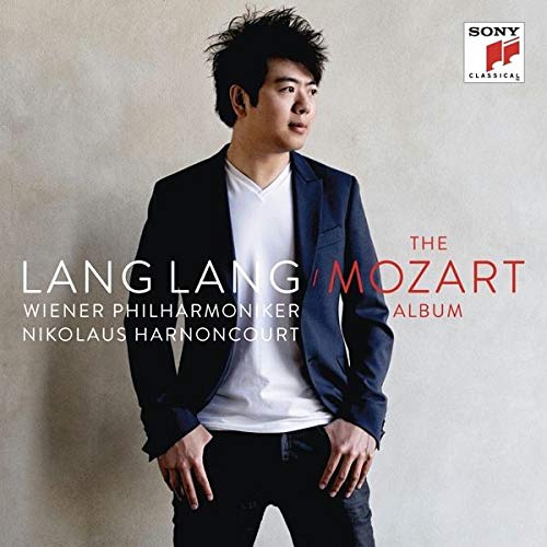 Lang Lang stands wearing a navy blazer and white shirt on this album cover.