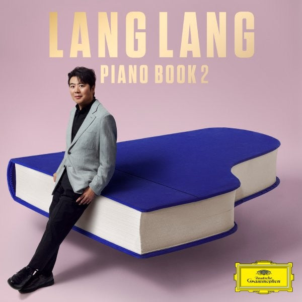 Lang Lang sits on a giant blue book with the album title.