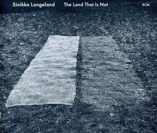 CD cover: a textured rug on grass, dark and atmospheric.