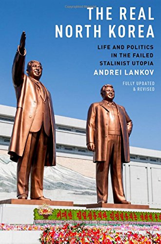 Book cover featuring two bronze statues of North Korean leaders against a blue sky.