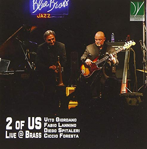 CD cover featuring two musicians playing bass and trumpet on stage.