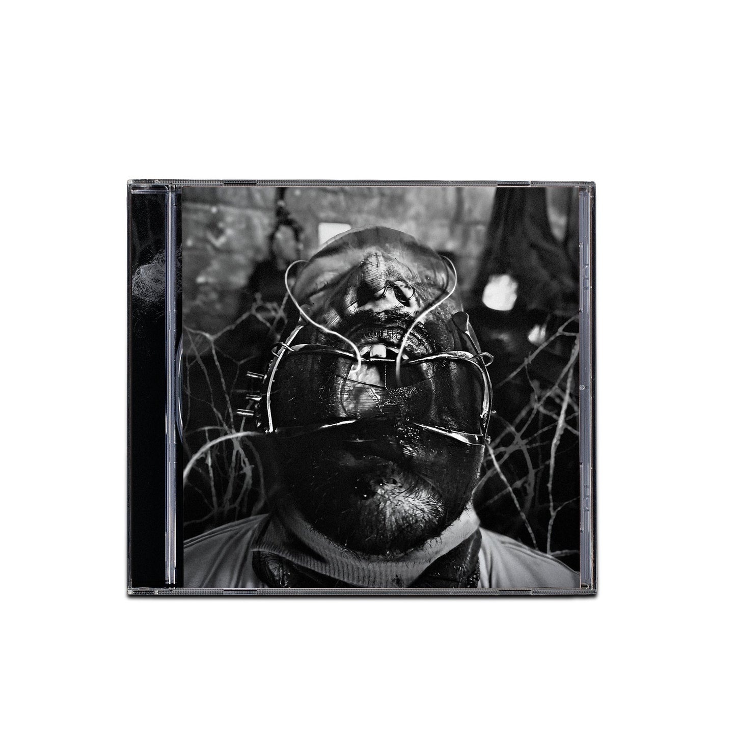 Black and white CD cover featuring a person with a metallic mask.