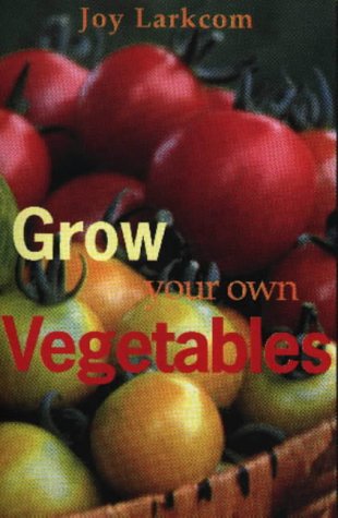 Book cover with red tomatoes and text “Grow Your Own Vegetables”.