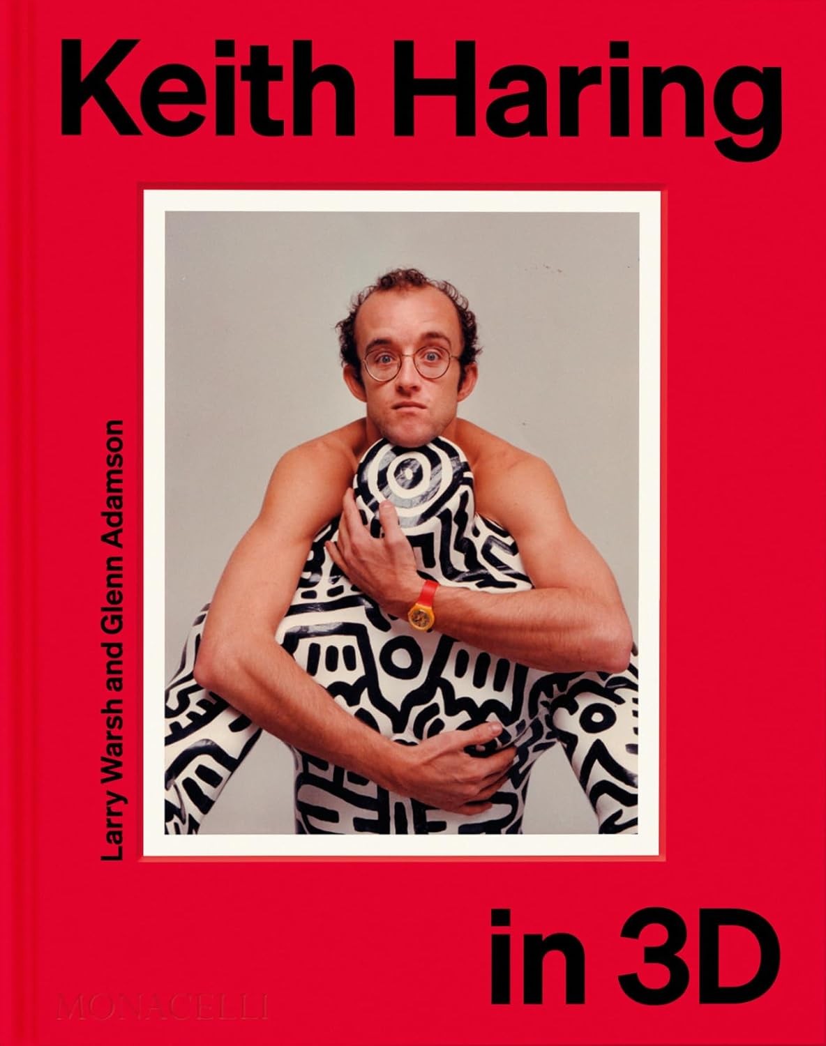 Red book cover featuring a portrait of artist Keith Haring.