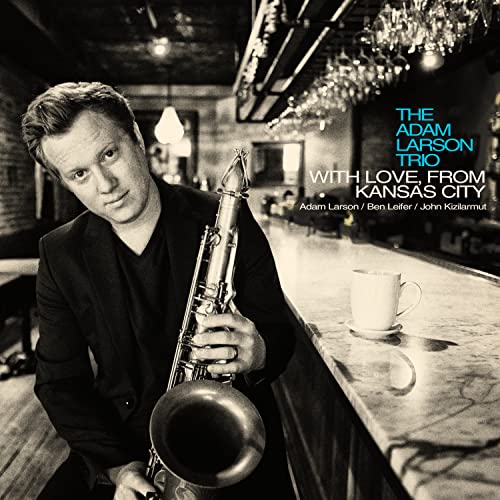 Adam Larson holding a saxophone in a bar, CD cover art.
