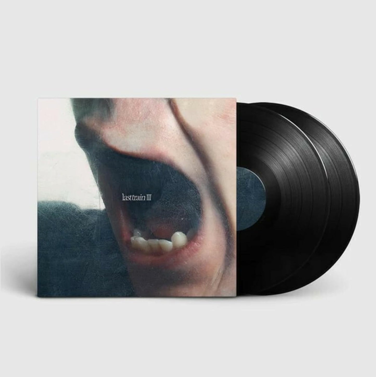Vinyl record with album cover featuring a close-up of a mouth.