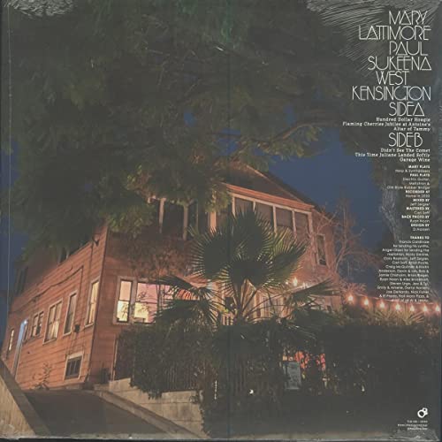 Record cover depicting a large, illuminated house under a night sky.