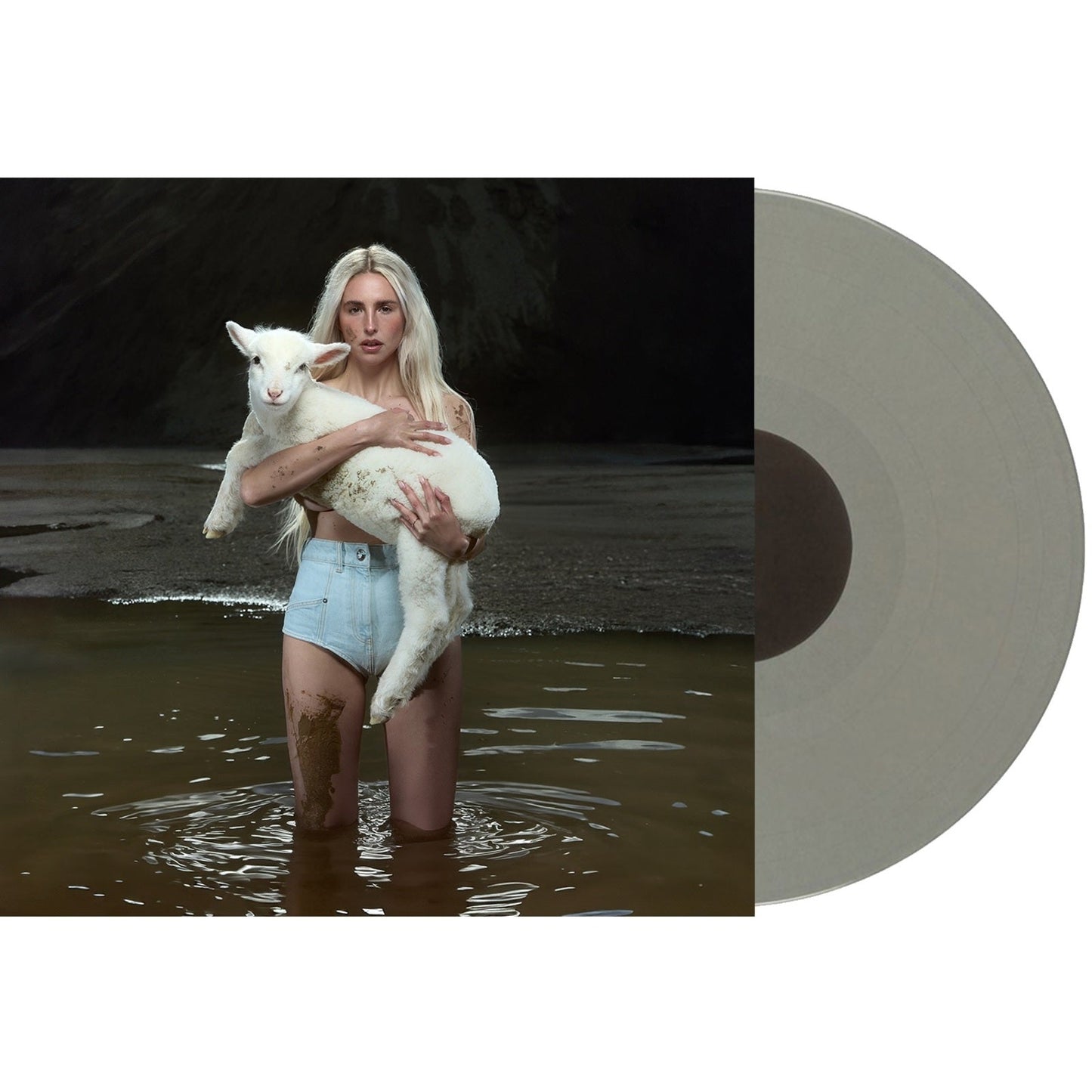 A woman with a lamb stands in water next to a grey vinyl record.