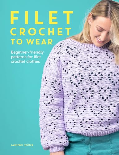 A woman wearing a light purple filet crochet sweater with a heart pattern.
