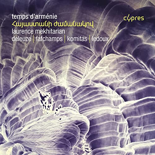 CD cover with abstract blue and white floral design and text.