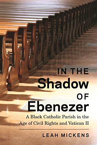 Book cover: church pews, title “In the Shadow of Ebenezer,” author Leah Mickens.