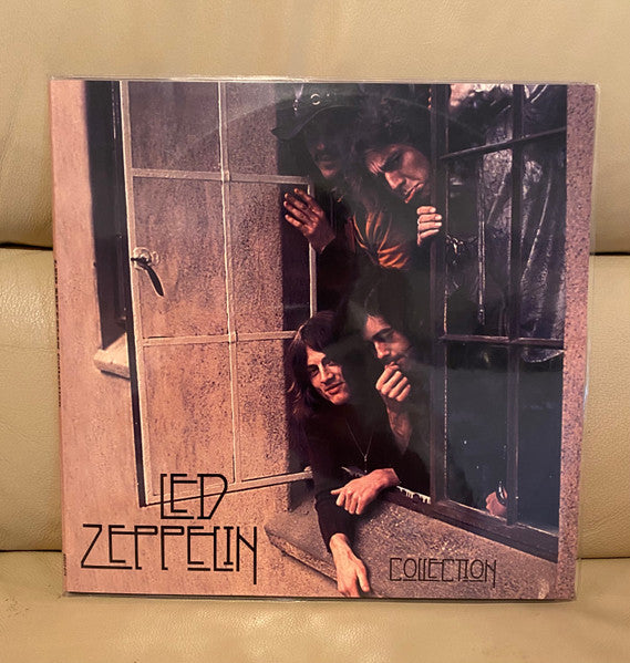 Led Zeppelin “Collection” vinyl record cover with band members in a window.