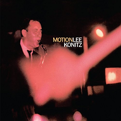 Blurry image of a saxophonist performing, with "Motion Lee Konitz" text in the background.