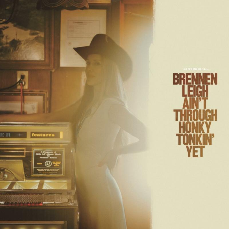 CD cover: woman in a cowboy hat standing by a jukebox.