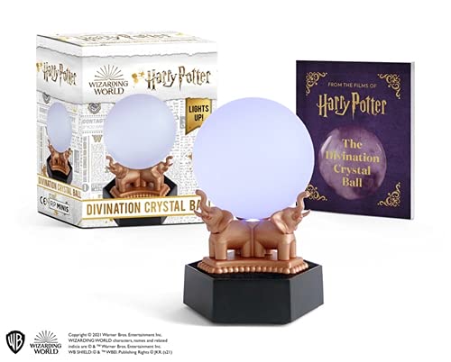 Illuminated purple crystal ball on a stand with three golden griffins.