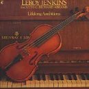 CD cover featuring a brown violin resting on a piano keyboard.