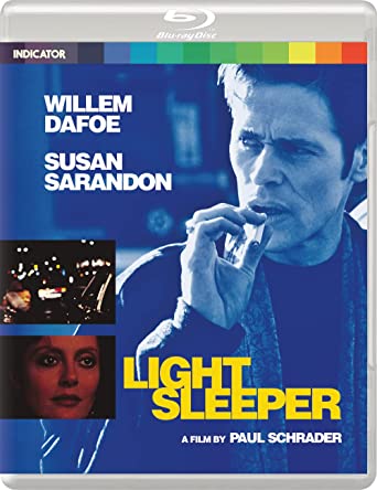 "Blu-ray case with blue cover featuring Willem Dafoe smoking, with title 'Light Sleeper'."