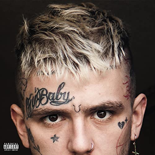 Close-up portrait of Lil Peep with face tattoos and bleached hair.