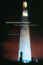 Book cover with a tall, illuminated monument and a blurred figure.