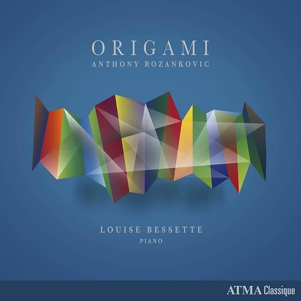 CD cover with abstract geometric design in shades of blue, green, and red.