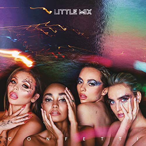 Four women with glittery makeup pose against a dark background with colorful light streaks.