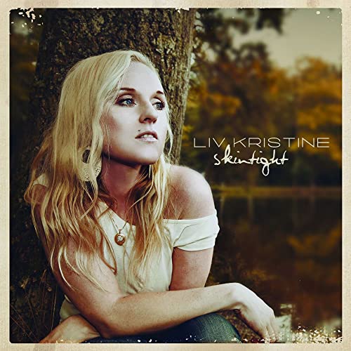 CD cover featuring Liv Kristine, a blonde woman looking left.