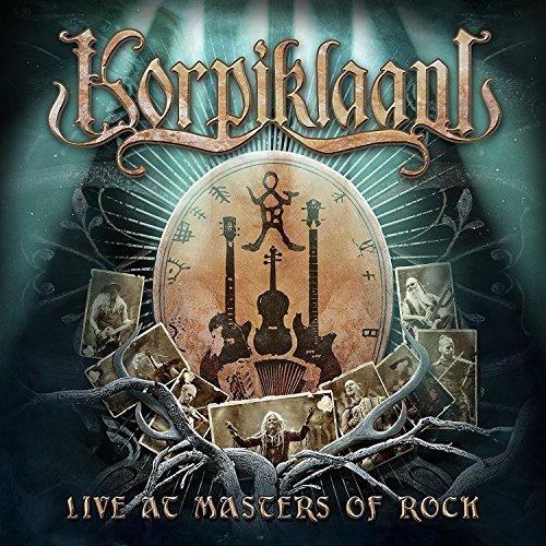 Album cover featuring instruments, band photos, and "Live At Masters Of Rock" text.