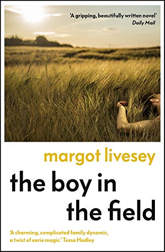 Book cover: golden field with a person lying amongst the wheat.