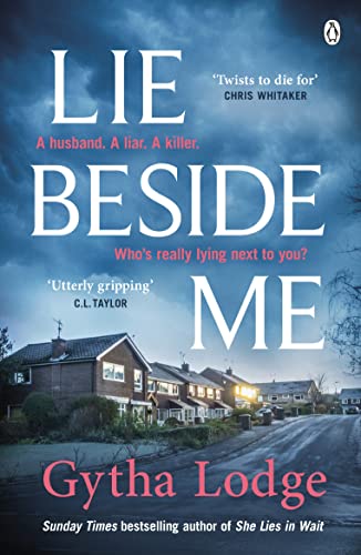 Book cover: "Lie Beside Me" with a house and stormy sky backdrop.