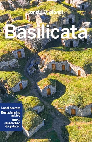 Lonely Planet travel guide cover featuring grass-roofed stone houses in Basilicata.