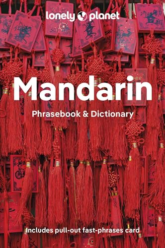 Lonely Planet Mandarin Phrasebook & Dictionary cover featuring red decorative tassels and hanging charms.