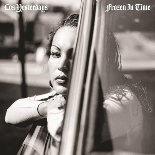 Black and white album cover featuring a woman looking out a window.