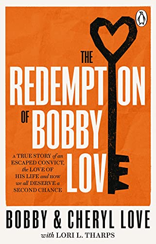 Orange book cover with white title text and a black key-shaped heart.