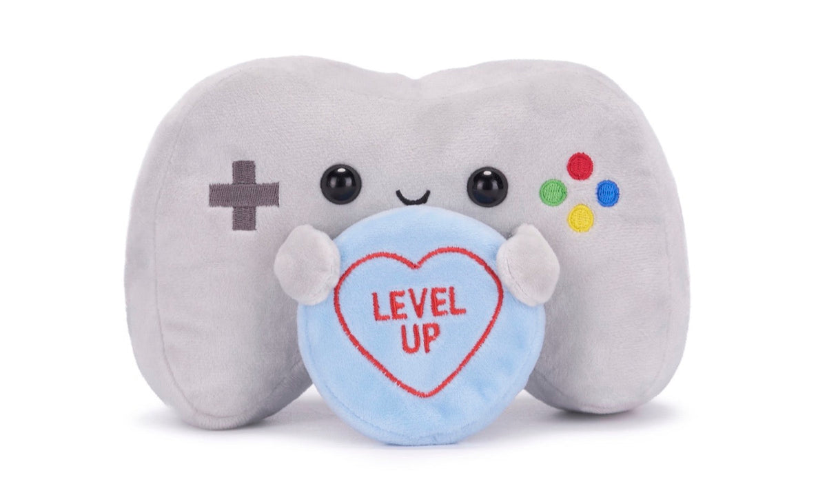 Gray plush game controller with a heart reading "LEVEL UP".