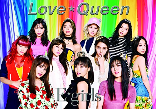 Nine young women with crowns pose against a rainbow and colorful backdrop.