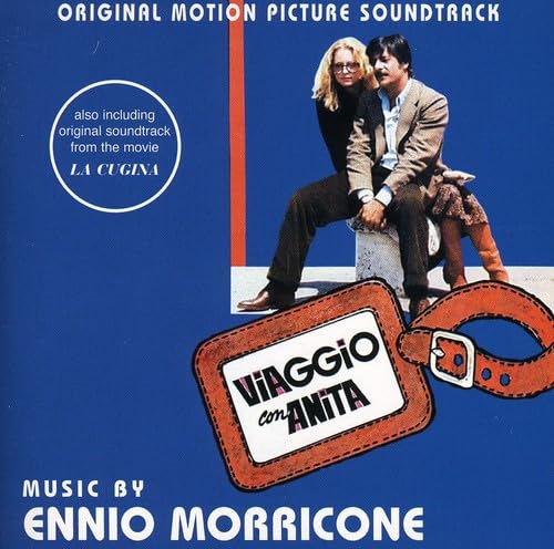 CD cover: couple, luggage tag, and bold text on a blue background.