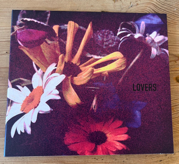 CD cover with a dark floral arrangement and the word "LOVERS".