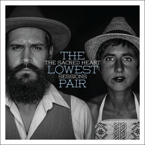 Black and white portrait of two people wearing hats, album cover.