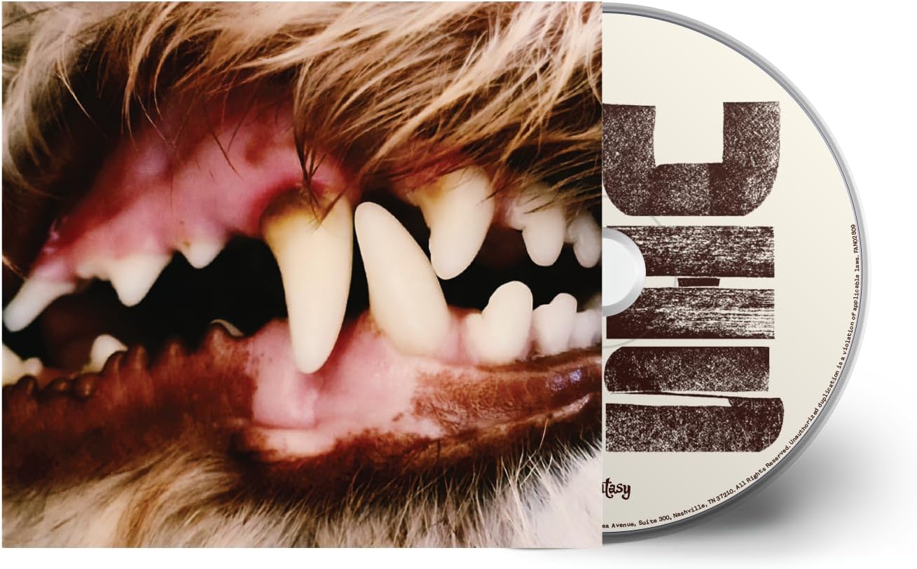 CD case with a close-up of a dog's face and large white lettering.