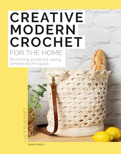 Crochet book cover with a beige crocheted bag and lemons.
