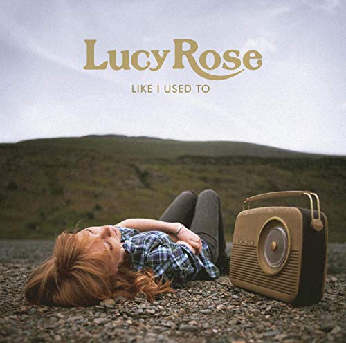 CD cover: woman with vintage radio against a hilly landscape.