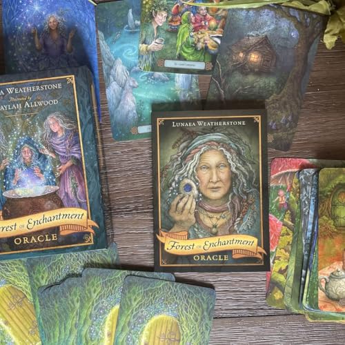 Oracle card deck with a portrait of a woman holding a glowing orb.