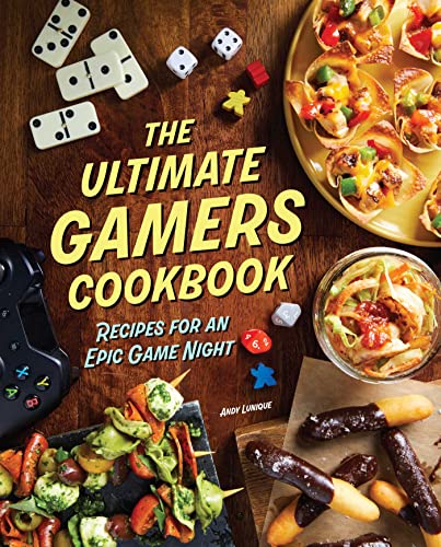 Cookbook cover with game pieces, controller, and colorful food arrangements.
