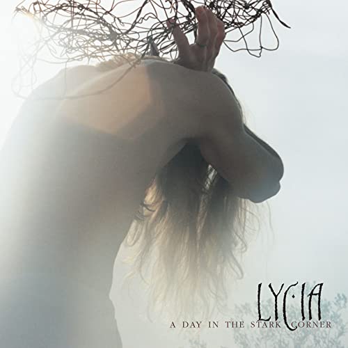 CD cover: person obscured by wire and bright light, text “Lycia”.