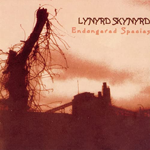 Lynyrd Skynyrd "Endangered Species" CD cover with a barren tree silhouette.