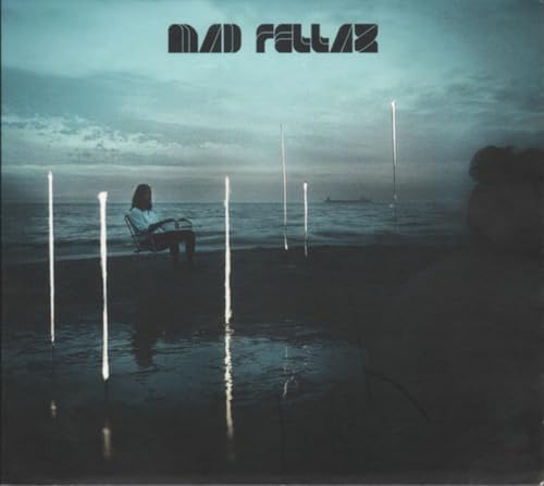CD cover: lone figure on a beach with glowing vertical lines.